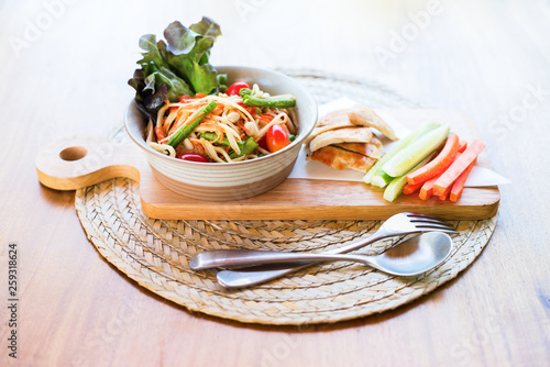 Thai food Papaya salad chicken served vegetables