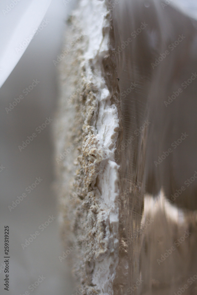 Close-up beautiful view of transparent quartz crystal in junction with natural bark Close-up beautiful view of transparent quartz crystal in junction with natural bark