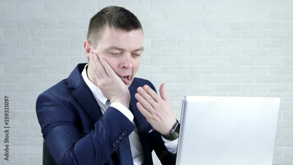 Tired sleepy businessman sitting with closed eyes at workplace, overworked man falling asleep at work Tired sleepy businessman sitting with closed eyes at workplace, overworked man falling asleep at work