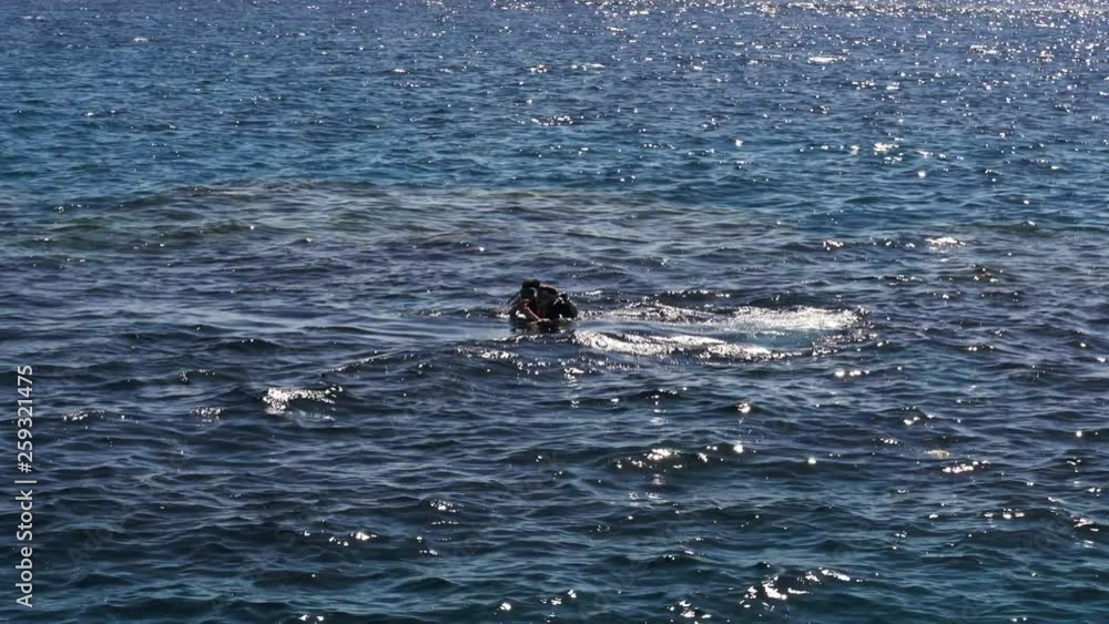 Guy with an instructor dives after diving in the red sea Guy with an instructor dives after diving in the red sea