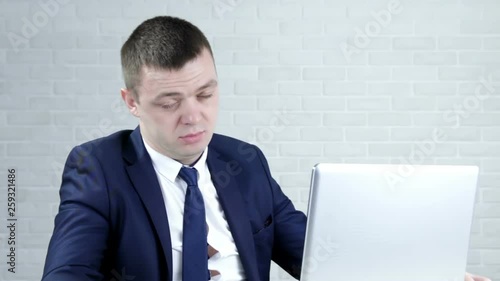 A drunk businessman in the office