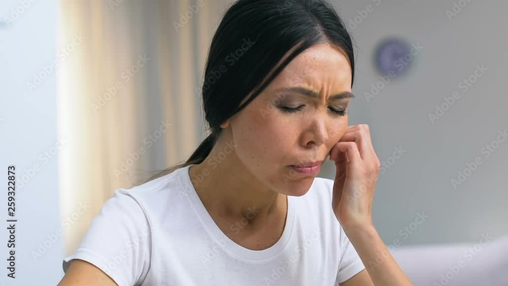 Female freelancer looking through graphs, biting apple and feeling pain, carries Female freelancer looking through graphs, biting apple and feeling pain, carries