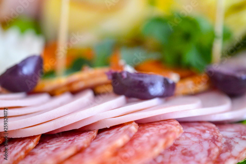 wll decorated party catering food,slami , pepperoni, slice of olive, shallow dof photo