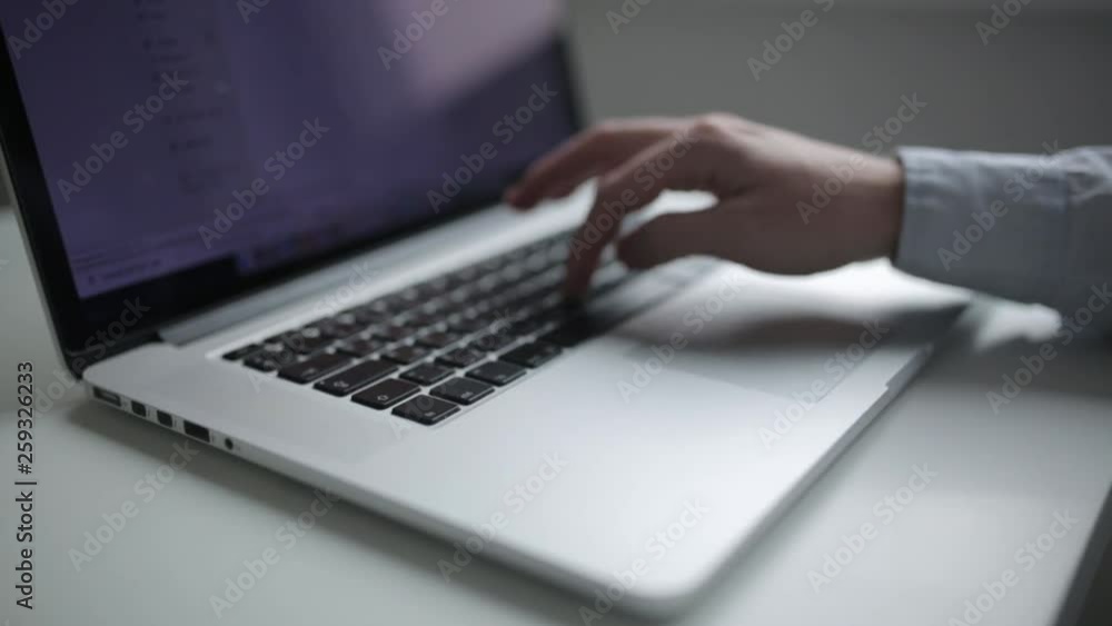 Work in the office, social networking. Printing text on the laptop, the hands of a hipster. Work in the office, social networking. Printing text on the laptop, the hands of a hipster.