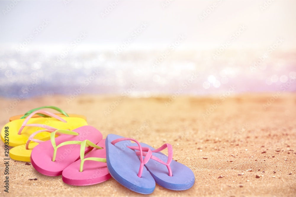 Pairs Of Flip-flops On Beach, vacation concept