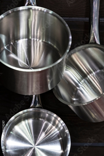 Several new metal pans shot close-up in the kitchen