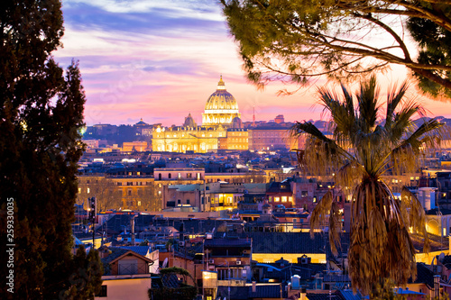 Rome rooftops and dome of the Papal Basilica of Saint Peter in Vatican evening view