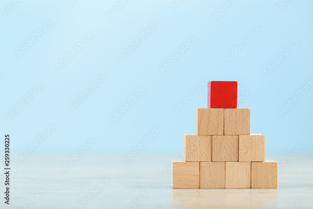 Stacking wooden blocks into steps,Concept of business growth success Stacking wooden blocks into steps,Concept of business growth success
