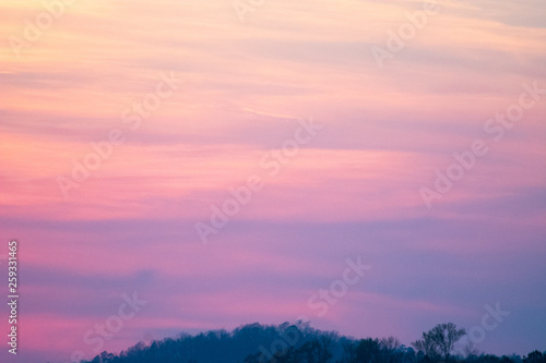 sky and clouds over hills at sunset