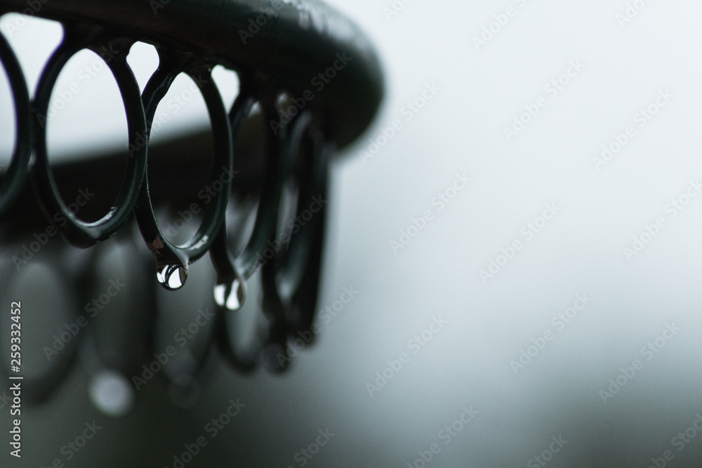 Monochome Selective focus of drop dew on black metal with blurred background Monochome Selective focus of drop dew on black metal with blurred background