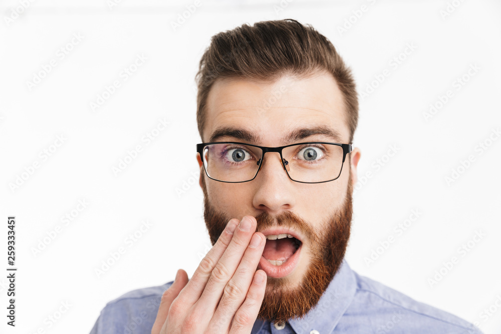 Close up image of Surprised bearded elegant man in eyeglasses Close up image of Surprised bearded elegant man in eyeglasses