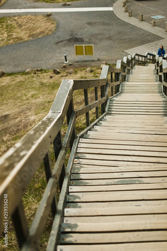 Wooden stairs leading down the slope in Iceland