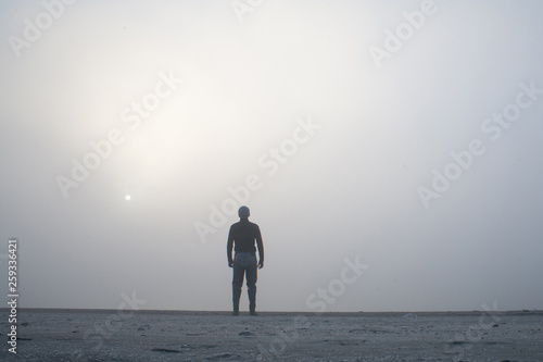 Photography Man disappearing in the white fog