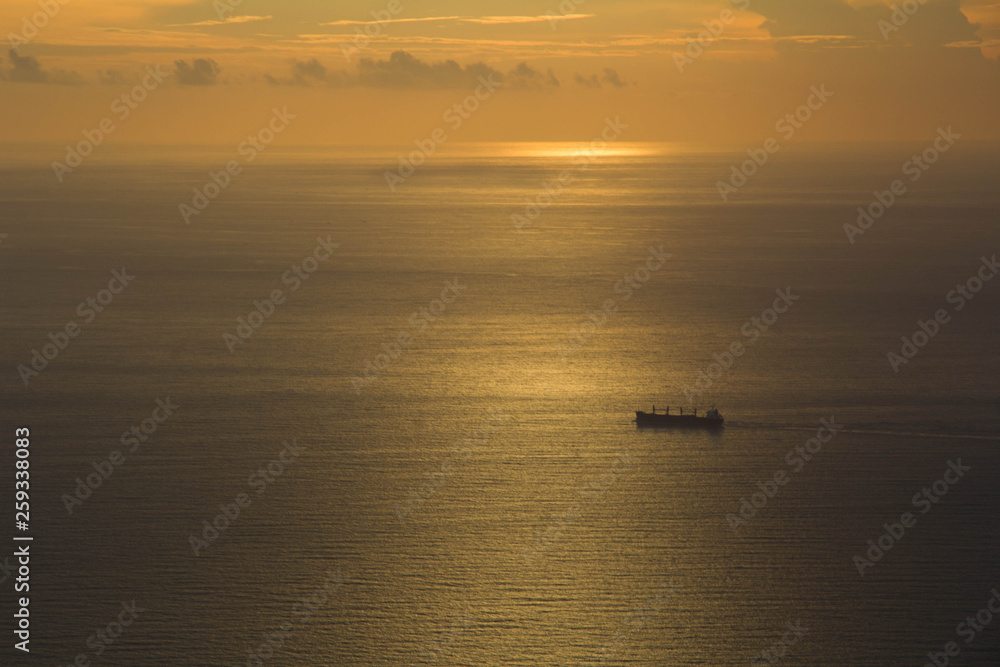 sunset with ship at the sea