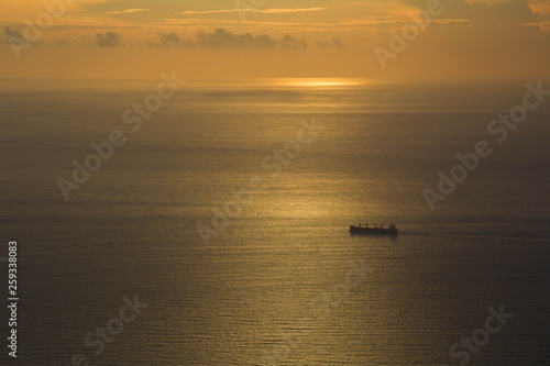 sunset with ship at the sea © varsha kariya