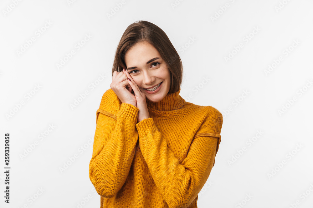 Lovely young girl wearing braces standing isolated Lovely young girl wearing braces standing isolated