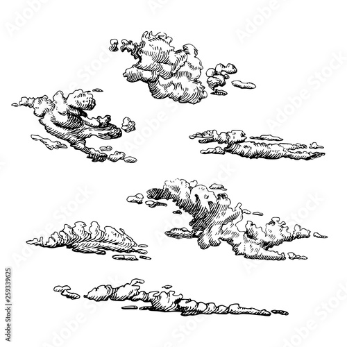 Clouds set, hand drawn in engraving style. Vector graphic illustration of cloudy sky.