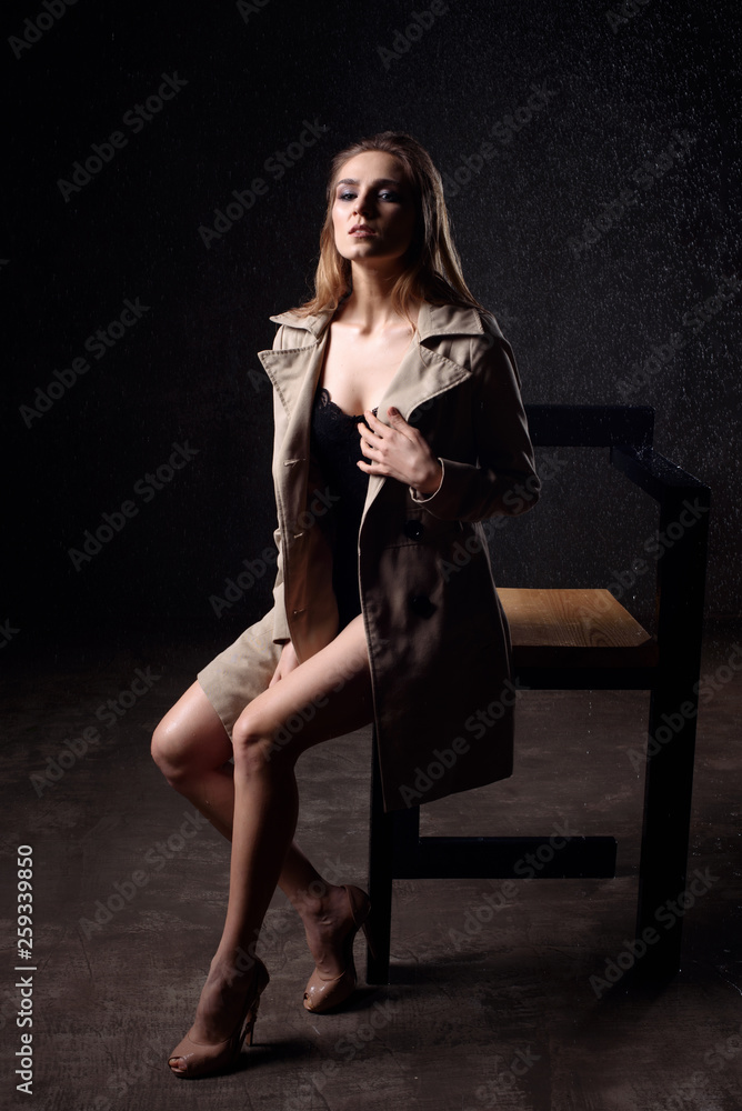 Fototapeta premium fashion portrait of young sexy wet woman siting on the chair