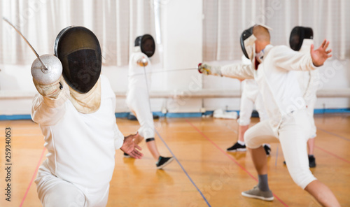 Positive fencer practicing lunge with foil