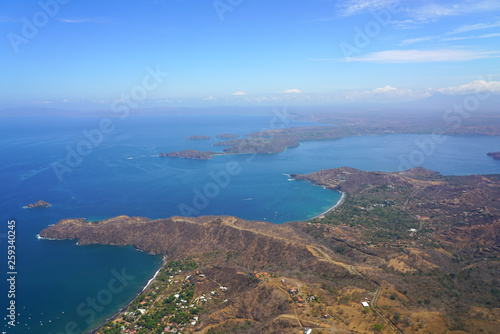 Fototapeta Naklejka Na Ścianę i Meble -  Aerial view of the Golfo del Papagayo with the Peninsula Papagayo near Liberia, Guanacaste, Costa Rica, during the dry season
