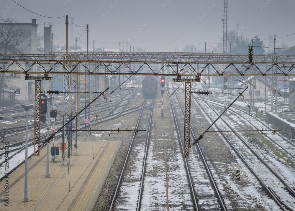Railroad station in winter time with old tracks Railroad station in winter time with old tracks
