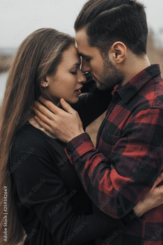 Young romantic couple is kissing and enjoying the company of each other. Young romantic couple is kissing and enjoying the company of each other.
