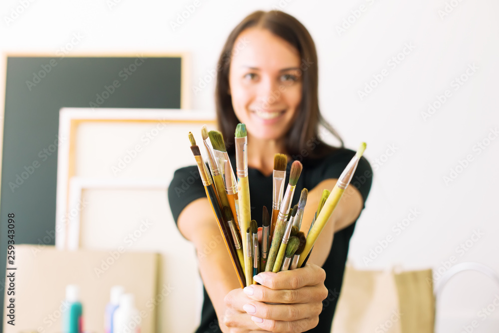 girl black dress holds hands bunch brushes girl black dress holds hands bunch brushes