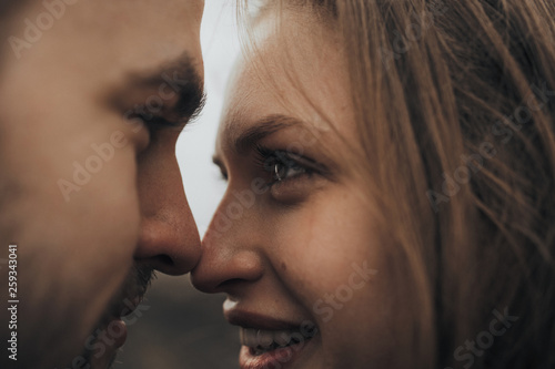 Young romantic couple is kissing and enjoying the company of each other.