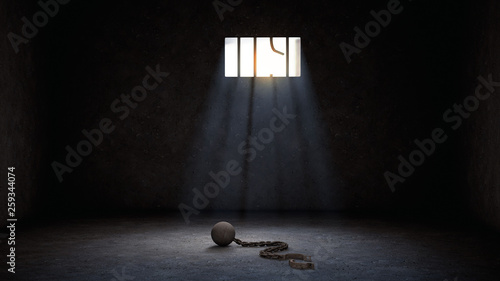 ball and chain for prisoner in jail with broken prison bars, prison escape or jailbreak concept photo