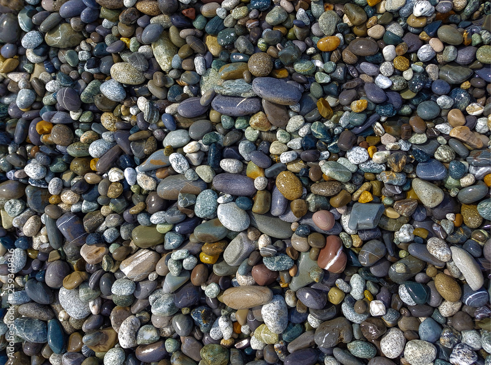 pebbles on the beach, rubble on the seashore, top view pebbles on the beach, rubble on the seashore, top view