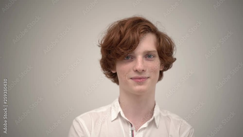 Handsome ginger with stylish haircut smiling and looking good Handsome ginger with stylish haircut smiling and looking good