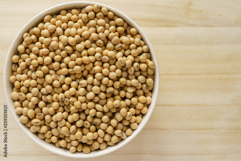 Soybean in the bowl on the wooden tray Soybean in the bowl on the wooden tray