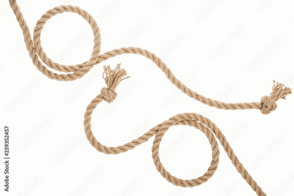 brown curled ropes with knots isolated on white
