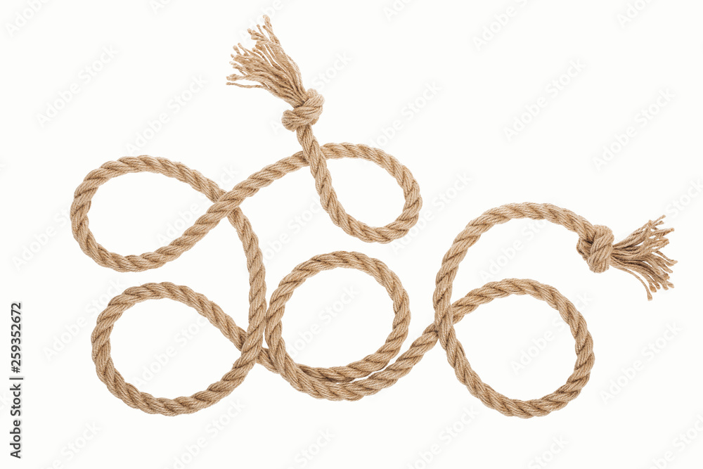 long brown jute rope with knots and curls isolated on white