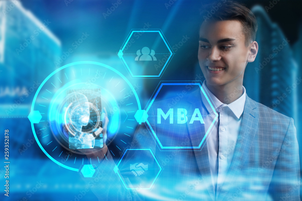 The concept of business, technology, the Internet and the network. A young entrepreneur working on a virtual screen of the future and sees the inscription: MBA The concept of business, technology, the Internet and the network. A young entrepreneur working on a virtual screen of the future and sees the inscription: MBA