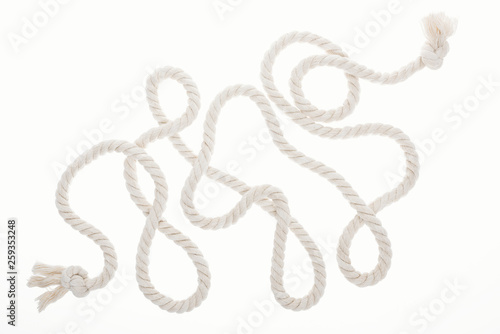 long white rope with curls and knots isolated on white