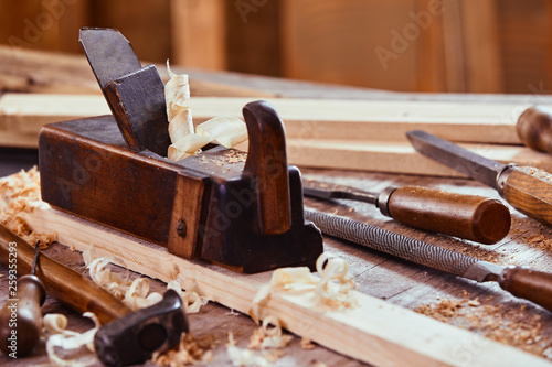 Cuadro en lienzo Wooden plane with rasp, file, hammer and chisels