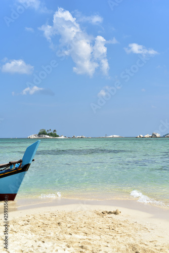 Touristic boat docken on the shoe in Lengkuas Island, Belitung Island, Indonesia photo