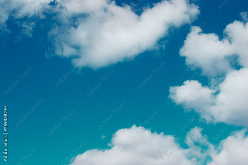 Beautiful Nature Background.  Blue Sky And White Clouds Background With A Lot Of Copy Space For Text.