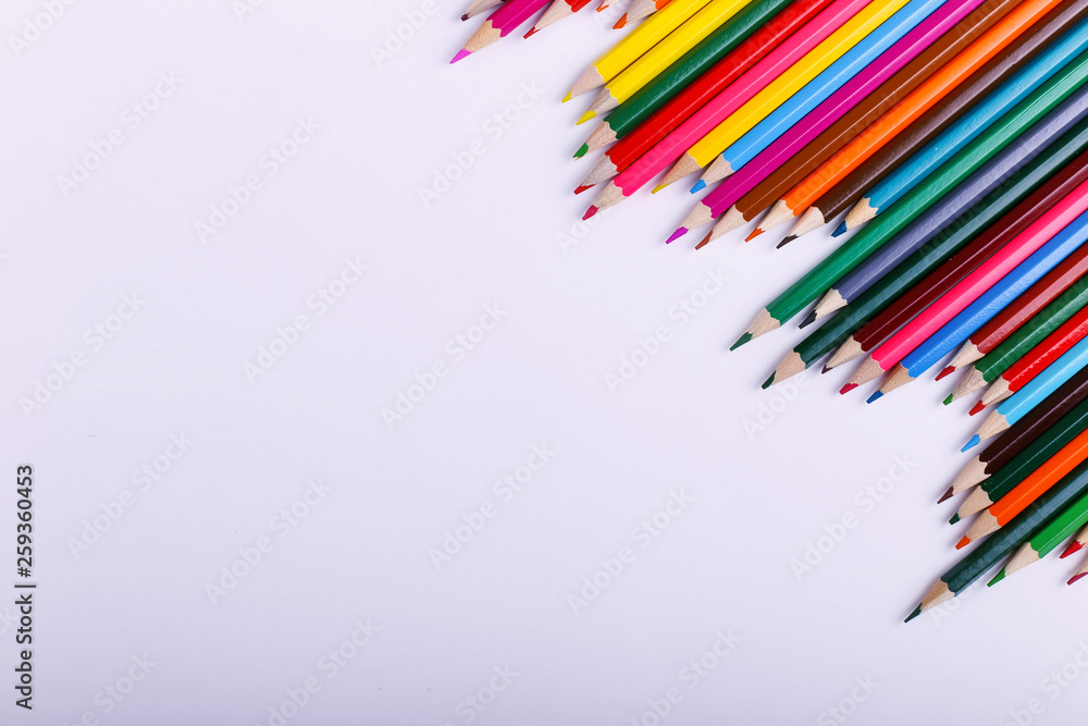 Fototapeta premium Colored pencils, on the white background, pattern, copy space.