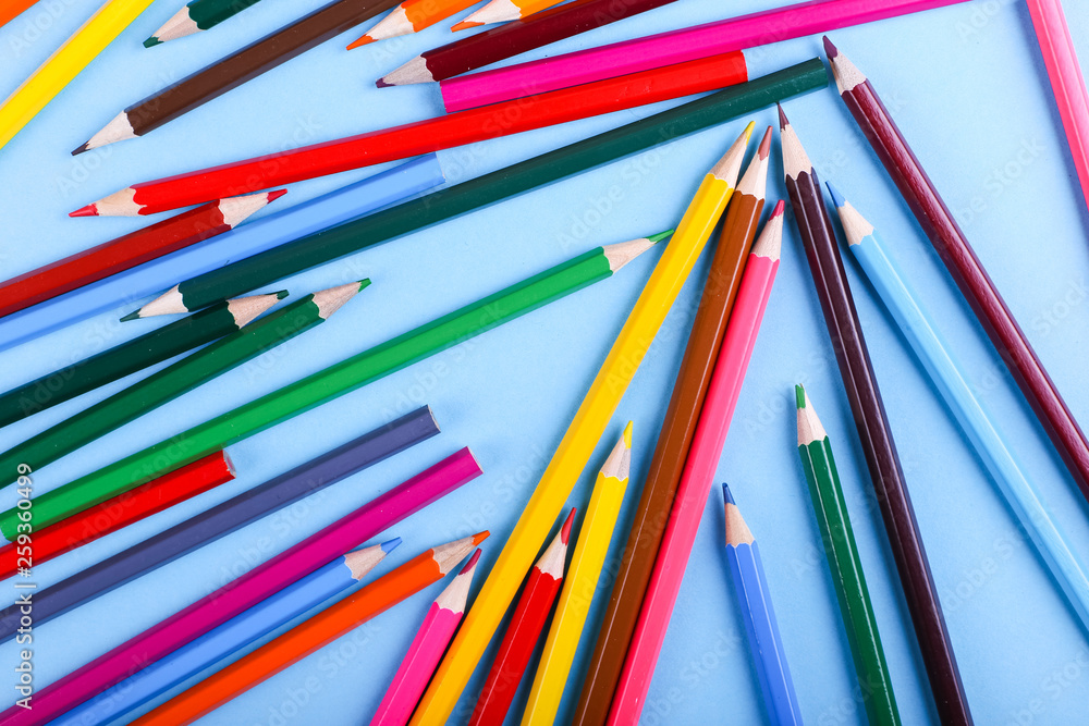 Colored pencils, on blue background, pattern, copy space. Colored pencils, on blue background, pattern, copy space.