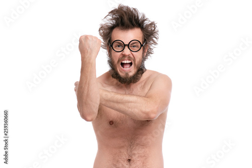 Crazy bearded Angry Man with funny Haircut in Eyeglasses Screaming and making Bad gesture. Naked guy, isolated on white background.