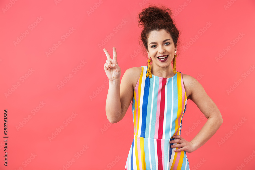 Portrait of a cheerful young woman wearing dress Portrait of a cheerful young woman wearing dress