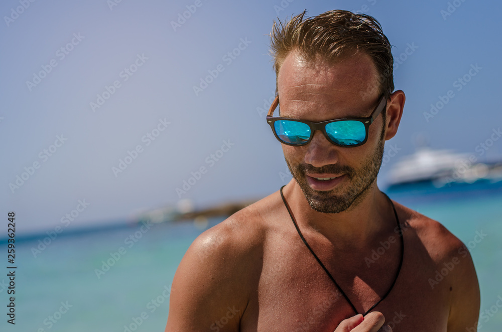 Shirtless man enjoying the beach Shirtless man enjoying the beach