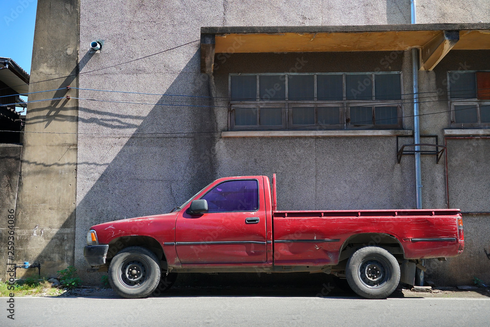 Old red truck park on the street