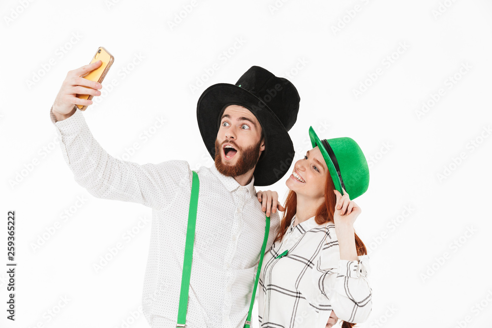 Happy young couple wearing costumes, celebrating Happy young couple wearing costumes, celebrating