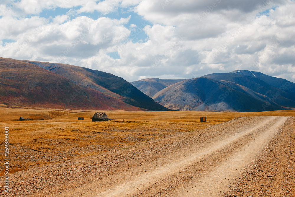 Mountain road spring ranges landscape. Mountain hill road panorama Mountain road spring ranges landscape. Mountain hill road panorama