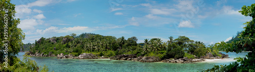 Beautiful panoramic view of one island from Seychelles, the Indian Ocean and the blue clear sky with easy clouds