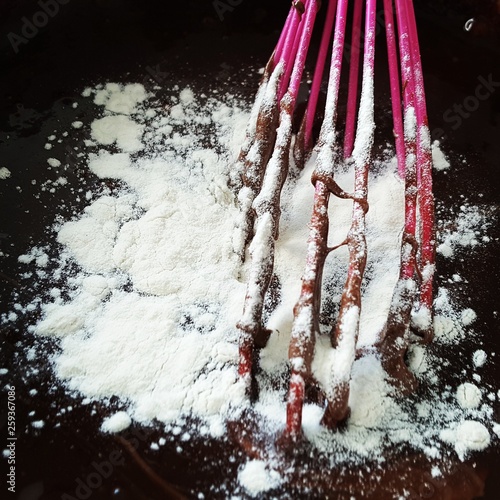 Chocolate brownie dough with flour and  photo