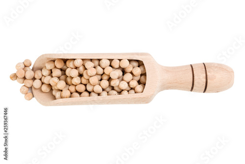 Yellow pea in wooden scoop isolated on white background. nutrition. bio. natural food ingredient.